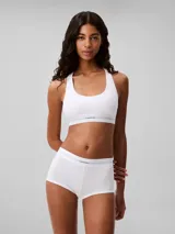 Bombacha hípster blanca de algodón modal con textura de canalé y cintura elástica con logo Calvin Klein.
