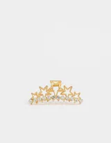 Broche dorado para el pelo con forma de pinza y diseño de estrellas con strass.