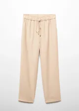 Pantalón color beige de corte recto y fluido, con cintura elástica ajustable con lazo.