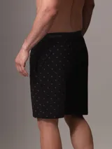 Short de pijama negro con cintura elástica con logo Calvin Klein, bolsillos laterales y bragueta falsa.