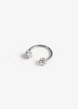 Piercing septum de acero quirúrgico hipoalergénico, con bolitas y strass, sistema de cierre a rosca.