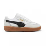 Championes Puma Palermo Lamoda, color blanco con detalles en negro y suela color caramelo.