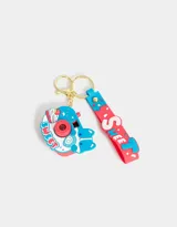 Llavero con forma de cámara de fotos azul y roja con strap de silicona con la palabra "Sweet" en letras blancas. Proyecta imágenes (luz y sonido).