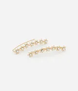 Par de caravanas ear cuff doradas con forma de flores y pedrería de strass.
