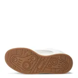 Zapatillas deportivas negras con detalles en blanco, suela blanca y base marrón.