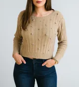 Sweater color beige de tejido de punto con cuello redondo y apliques de strass.