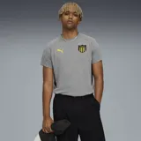 Remera gris de algodón con logo de Puma amarillo y escudo del Club Atlético Peñarol en el pecho.