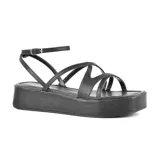 Sandalias negras con plataforma, tiras finas y pulsera con hebilla al tobillo.