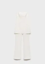 Mono largo blanco, strapless, de corte recto y con aberturas en el bajo. Cierre de cremallera en la parte posterior y forro interior.