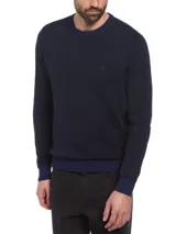 Sweater de punto azul marino con diseño jacquard bitono, cuello redondo y logo bordado de Original Penguin.