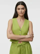 Chaleco verde lima de lino y viscosa con cierre de botones y bolsillos laterales.