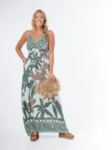 Vestido largo de algodón con estampado de hojas, breteles regulables y corte imperio.