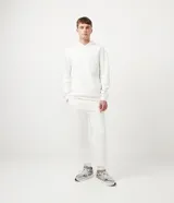 Pantalón de jogging blanco de algodón y poliéster, corte jogger, con cintura elástica ajustable y bolsillos delanteros.