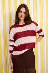 Falda larga marrón con base de tela plisada y largo godet. Confeccionada en gasa y microtul.