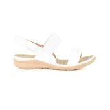 Sandalias bajas negras con dos tiras elásticas sobre el empeine y ajuste con velcro en el tobillo.
