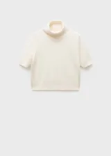 Jersey de cashmere color crema, con cuello alto y mangas cortas.