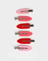 Set de seis hebillas para el pelo tipo pico de cigüeña, en colores rosa claro, rosa, rojo y fucsia.