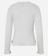Cárdigan de punto color marrón óxido con diseño calado, cuello en V, cierre frontal con botones blancos, mangas largas con volados en los puños y volados en el ruedo.
