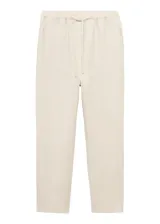 Pantalón de lino color beige, de corte recto, con cintura elástica ajustable con cordón.