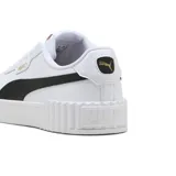 Championes Puma Carina 3.0 de cuero blanco con detalles en negro, plataforma texturizada y logo dorado.