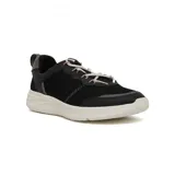 Zapatillas grises con detalles en lila, cordones elásticos y suela blanca.