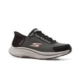 Championes deportivos Skechers Hands Free Slip-ins: GO RUN Consistent 2.0 - Empowered, color negro con detalles en gris y naranja. Diseñados con sistema Heel Pillow, capellada de malla con cordones ajustables, amortiguación ULTRA LIGHT y plantilla Skechers Air-Cooled Memory Foam.