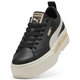 Championes Puma Mayze Lth negros con franja lateral color arena y suela de plataforma color crema.