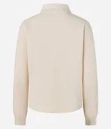 Suéter color crema de algodón y poliéster, con cuello polo, manga larga ajustada y abotonado delantero.