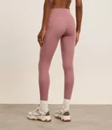 Calza legging deportiva color verde agua, de microfibra, con cintura ancha y bolsillos laterales.