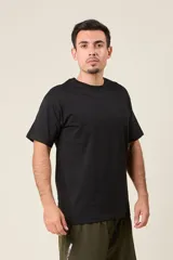 Remera marrón de corte holgado con estampado de un ave y texto en la espalda.