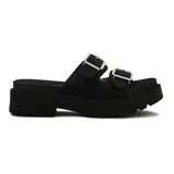 Sandalia tipo mule de plataforma gruesa y negra, con dos tiras anchas ajustables con hebillas metálicas plateadas.