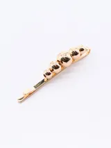 Broche dorado para el pelo con cuentas redondas de diferentes tamaños.
