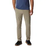Pantalón de trekking color beige, con tecnología Omni-Shield de repelencia al agua y Omni-Shade de protección solar UPF 50. Cuenta con elástico parcial en la cintura, bolsillos para las manos, bolsillo de seguridad con cremallera y bolsillos traseros.