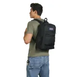 Mochila JanSport negra, modelo Cross Town Plus, con compartimento acolchado para laptop, base reforzada, espalda acolchada, bolsillo frontal con cierre y bolsillo lateral de malla. Logo de JanSport en el frente.