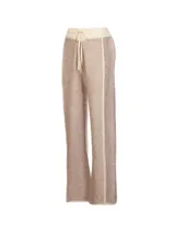 Pantalón de jogging tejido en tonos beige y crema, con cintura elástica con cordón ajustable y corte recto.