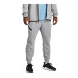 Pantalón de jogging gris de corte ajustado, con cintura elástica ajustable con cordón, bolsillos laterales con cierre y logo de Nike bordado en negro en la pierna izquierda.
