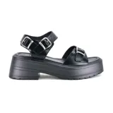 Sandalias marrones con plataforma, tiras anchas con hebillas y suela track.