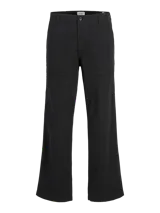 Pantalón chino negro de pierna ancha con cintura media y bajo doblado. Cierre con gancho y cremallera, bolsillos delanteros y traseros. Fit amplio en toda la pierna y muslos. Confeccionado en canvas, un tejido plano resistente que no se estira como los tejidos de punto.