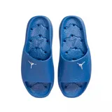 Ojotas tipo slide Jordan Franchise Shower, color azul vibrante, con tira ancha superior que presenta el logo Jumpman en blanco. La plantilla texturizada incluye el mismo logo en relieve para mayor agarre.
