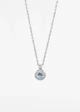 Cadena dorada de acero quirúrgico con dije circular con una piedra blanca rodeada de pequeñas circonitas.