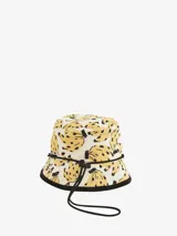 Sombrero tipo bucket con estampado de bananas y borde negro.
