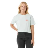 Remera corta color celeste con logo Rip Curl y dibujo de un sol en el pecho.