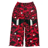 Pantalón de corte skinny, tiro bajo, con estampado camuflado en tonos rojo y negro, y estrellas blancas.