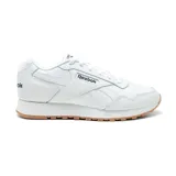 Championes Reebok Glide blancos con detalles en cuero sintético y suela de goma color caramelo.
