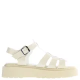 Sandalias franciscanas color nude con plataforma y hebilla lateral.