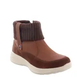 Botas de caña baja color marrón, con cierre lateral y detalle de tejido de punto en el tobillo.
