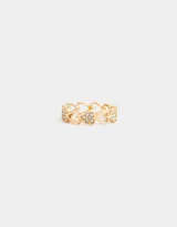 Anillo dorado con corazones calados y detalles de strass.