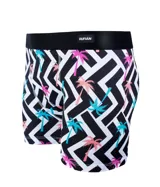 Boxer de lycra premium con estampado de palmeras sobre un fondo geométrico blanco y negro.