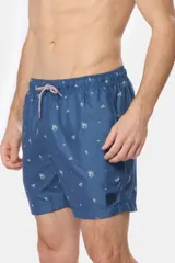 Short de baño azul con estampado de motivos marinos en blanco, cintura elástica con cordón ajustable, bolsillos laterales y suspensor de malla fina.