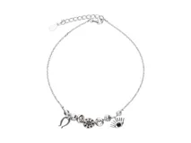 Pulsera de plata 925 con dijes de ojo, herradura, donas y bolitas con circonia.